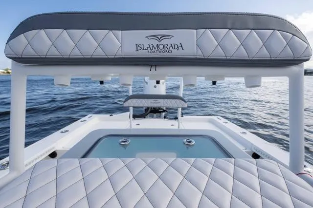 Slide: The Image of 2024 Islamorada Boatworks 24 with quilted seating, on calm water. - 19