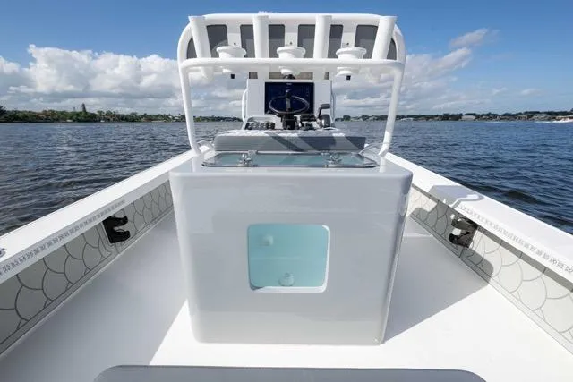 Slide: The Image of 2024 Islamorada Boatworks 24 on water, featuring sleek design and modern console. - 25
