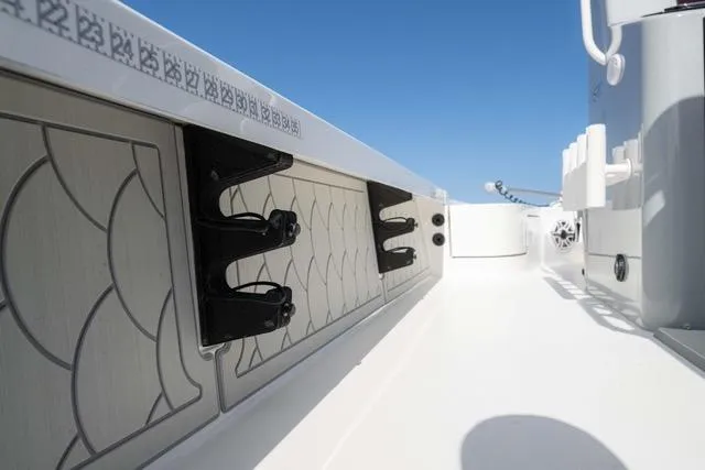 Slide: The Image of 2024 Islamorada Boatworks 24 interior, featuring sleek design and modern fittings under clear blue sky. - 26