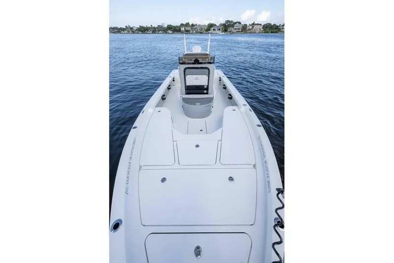 Slide: The Image of 2024 Islamorada Boatworks 24 on water, showcasing sleek deck design and spacious layout. - 46