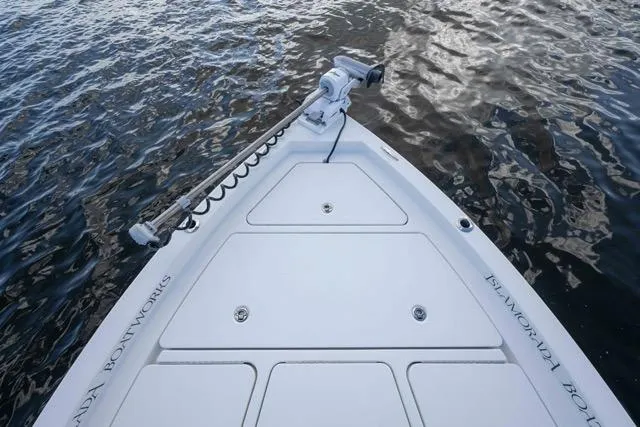 Slide: The Image of Bow of 2024 Islamorada Boatworks 24 on water, featuring sleek design and modern equipment. - 48