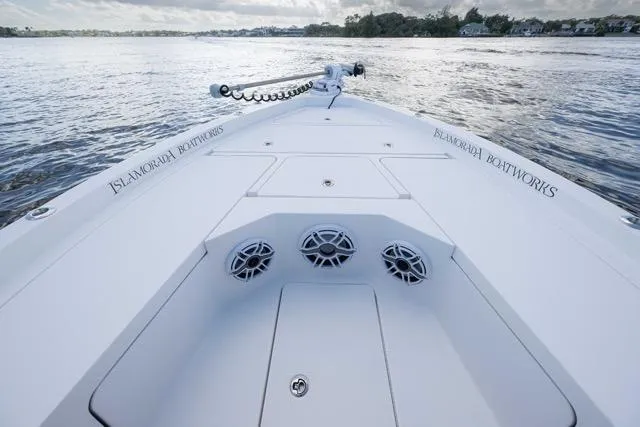 Slide: The Image of 2024 Islamorada Boatworks 24 on water, showcasing sleek design and advanced features. - 52
