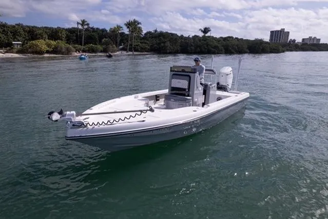 Slide: The Image of 2024 Islamorada Boatworks 24 on calm water near a tropical shoreline. - 54