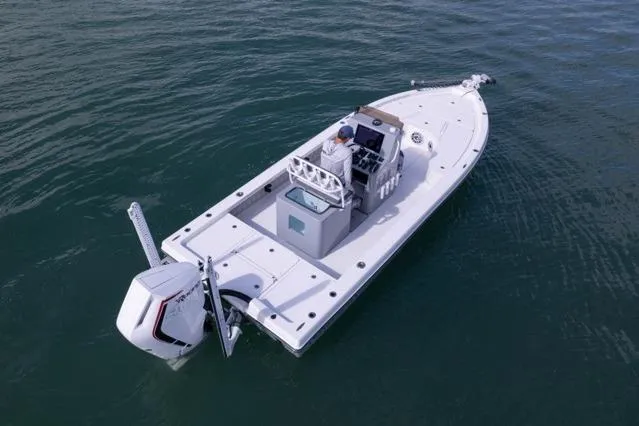 Slide: The Image of 2024 Islamorada Boatworks 24 on water, featuring sleek design and modern outboard motor. - 59