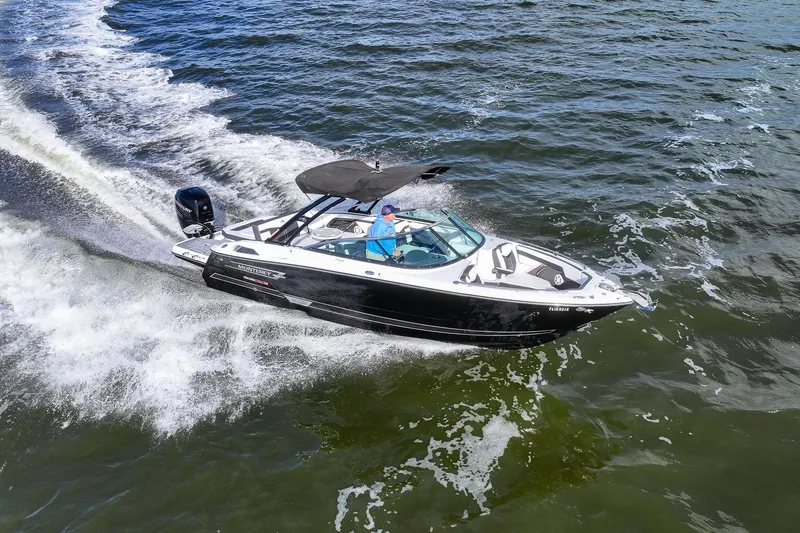 Slide: The Image of 2022 Monterey 275SS Super Sport boat cruising on open water. - 12