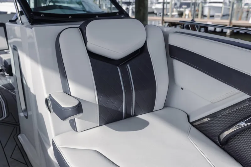 Slide: The Image of 2022 Monterey 275SS Super Sport boat interior with luxurious seating and armrest. - 16