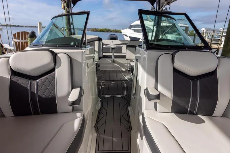 Slide: The Image of 2022 Monterey 275SS Super Sport boat interior with luxurious seating and sleek design. - 19