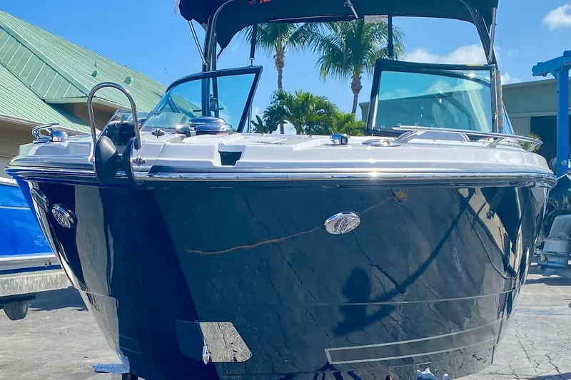 Slide: The Image of 2022 Monterey 275SS Super Sport boat cruising on a sunny day with clear blue skies. - 2