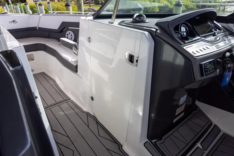 Slide: The Image of 2022 Monterey 275SS Super Sport boat interior with sleek seating and modern dashboard. - 23