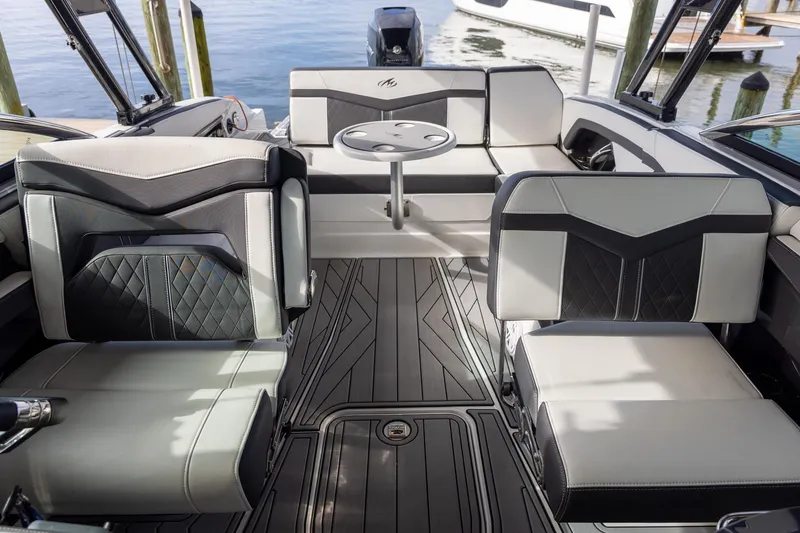 Slide: The Image of 2022 Monterey 275SS Super Sport boat interior with luxurious seating and sleek design. - 29