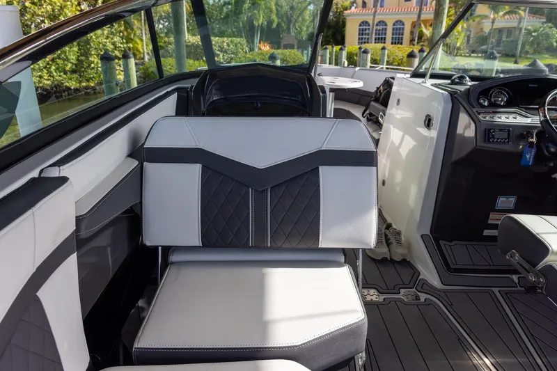 Slide: The Image of 2022 Monterey 275SS Super Sport boat interior with modern seating and dashboard. - 36
