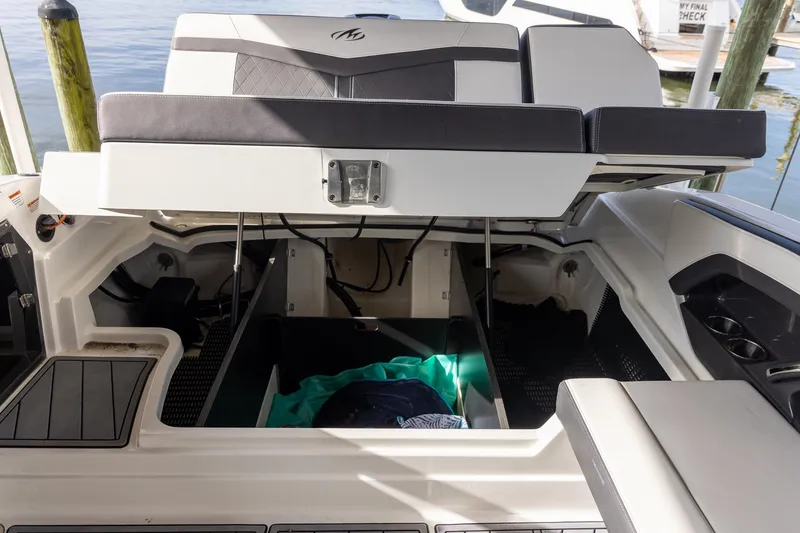 Slide: The Image of 2022 Monterey 275SS Super Sport boat with open storage compartment. - 42