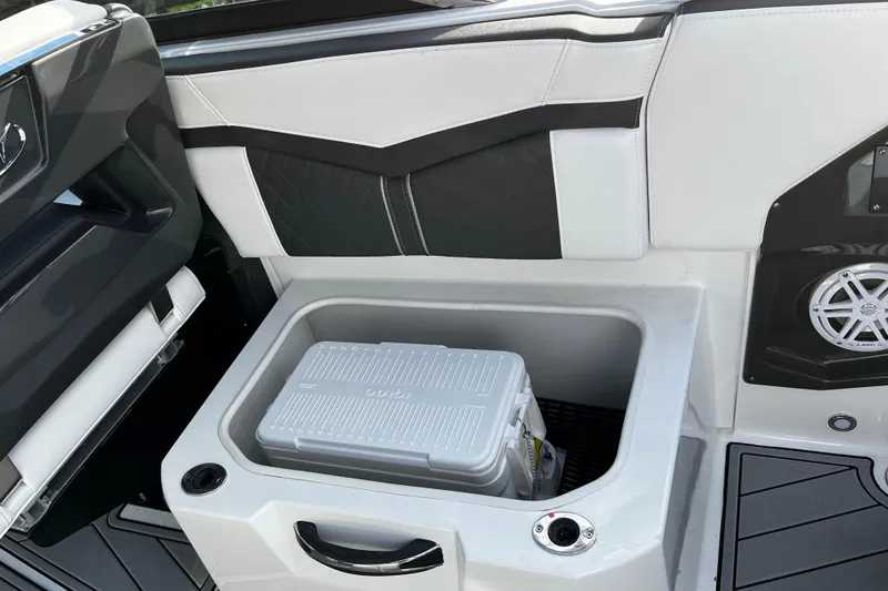 Slide: The Image of 2022 Monterey 275SS Super Sport boat cruising on water with a rainbow in the background. - 9