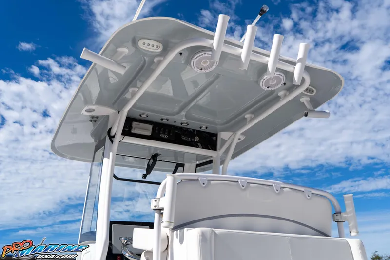 Slide: The Image of 2024 Sea Hunt Gamefish 27 boat with T-top against a blue sky background. - 35