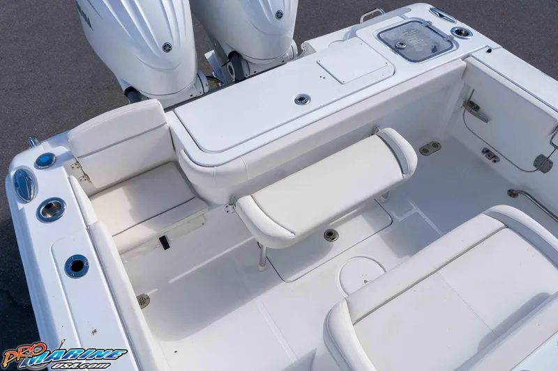 Slide: The Image of 2024 Sea Hunt Gamefish 27 boat interior with seating and dual engines. - 41