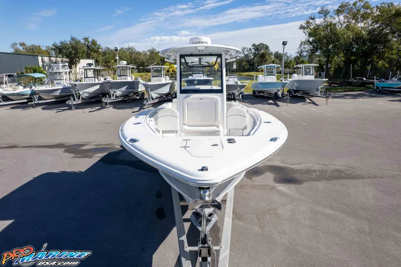 Slide: The Image of 2024 Sea Hunt Gamefish 27 boat displayed in a marina with clear skies. - 44