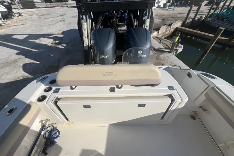 Slide: The Image of 2017 Cobia 277 Center Console boat with twin Yamaha 250 engines at dock. - 7