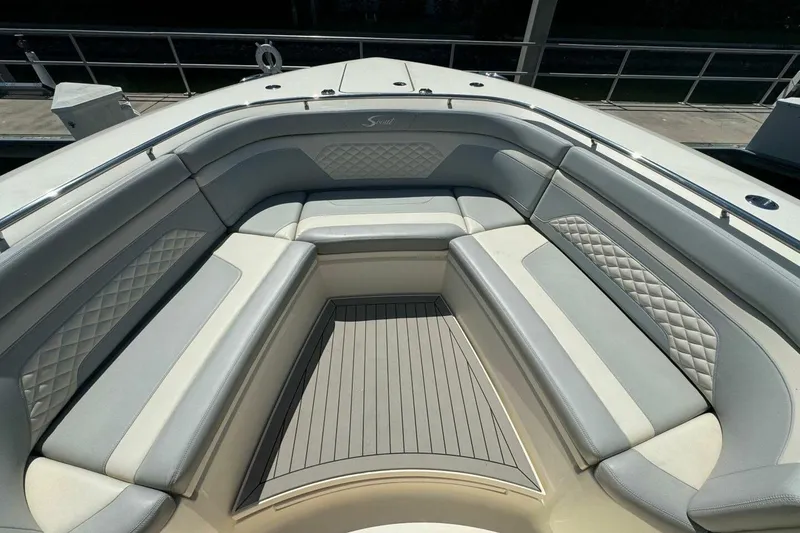 Slide: The Image of Luxurious seating area on a 2021 Scout 330 LXF boat, featuring elegant upholstery. - 13