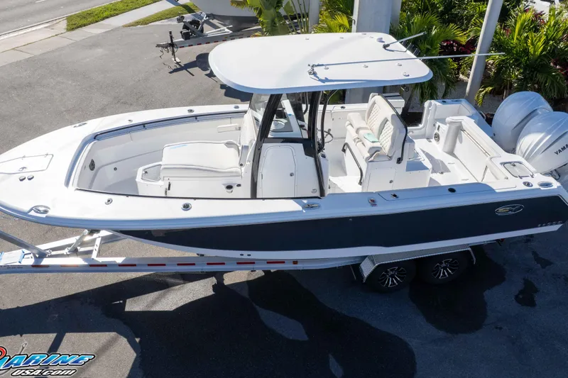 Slide: The Image of 2026 Sea Hunt Gamefish 27 Coffin Box boat on trailer, top view. - 12