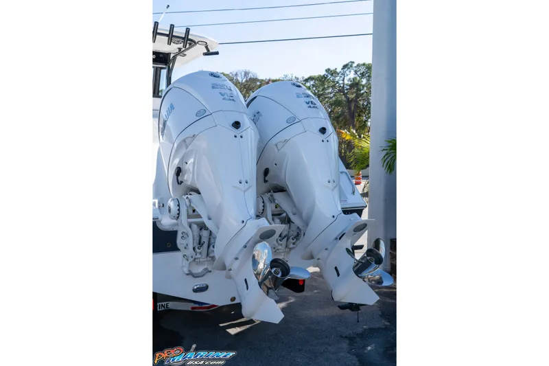 Slide: The Image of Twin outboard engines on a 2026 Sea Hunt Gamefish 27 Coffin Box boat. - 13