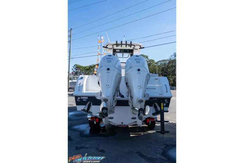 Slide: The Image of 2026 Sea Hunt Gamefish 27 Coffin Box boat with dual outboard engines, rear view. - 15