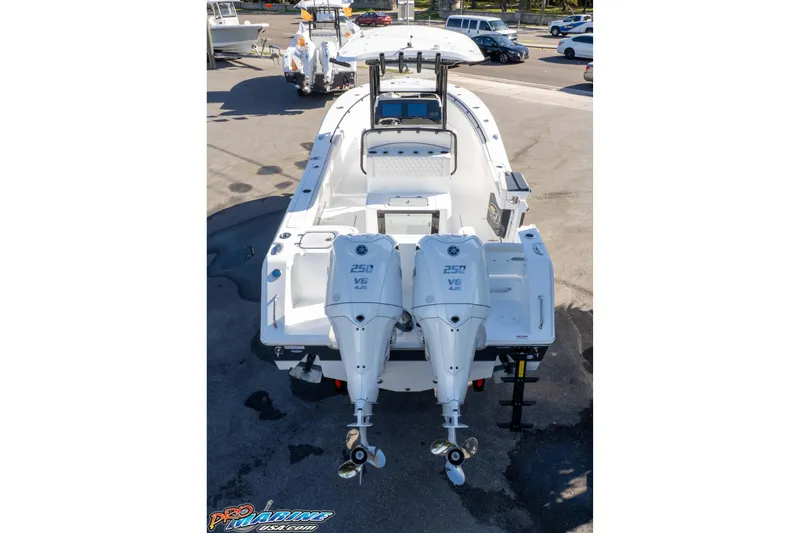 Slide: The Image of 2026 Sea Hunt Gamefish 27 Coffin Box boat with dual outboard engines, rear view. - 22
