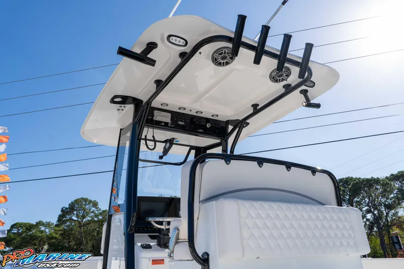 Slide: The Image of 2026 Sea Hunt Gamefish 27 Coffin Box boat with T-top and rod holders. - 27