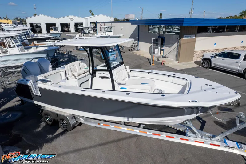 Slide: The Image of 2026 Sea Hunt Gamefish 27 Coffin Box boat on trailer at dealership. - 30