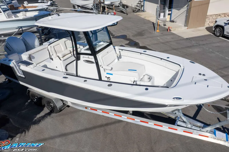 Slide: The Image of 2026 Sea Hunt Gamefish 27 Coffin Box boat on trailer, parked in marina. - 32