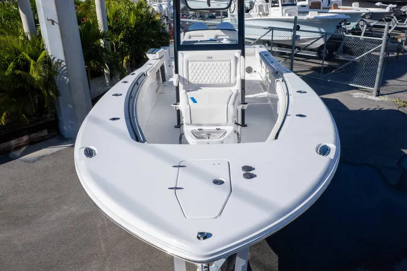 Slide: The Image of 2026 Sea Hunt Gamefish 27 Coffin Box boat, sleek design, docked outdoors. - 36