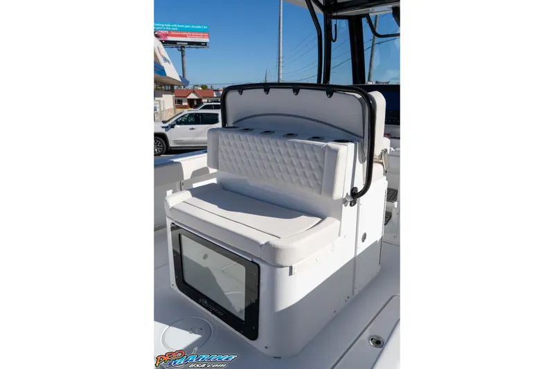 Slide: The Image of 2026 Sea Hunt Gamefish 27 Coffin Box boat interior with cushioned seating and storage. - 39