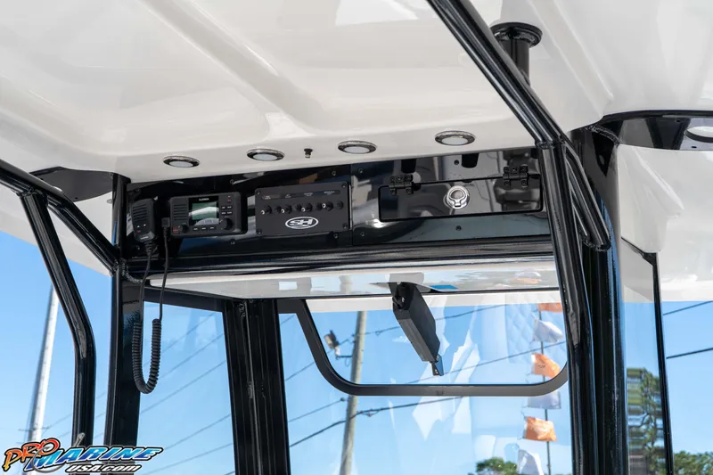 Slide: The Image of 2026 Sea Hunt Gamefish 27 Coffin Box boat console with electronics and controls. - 43