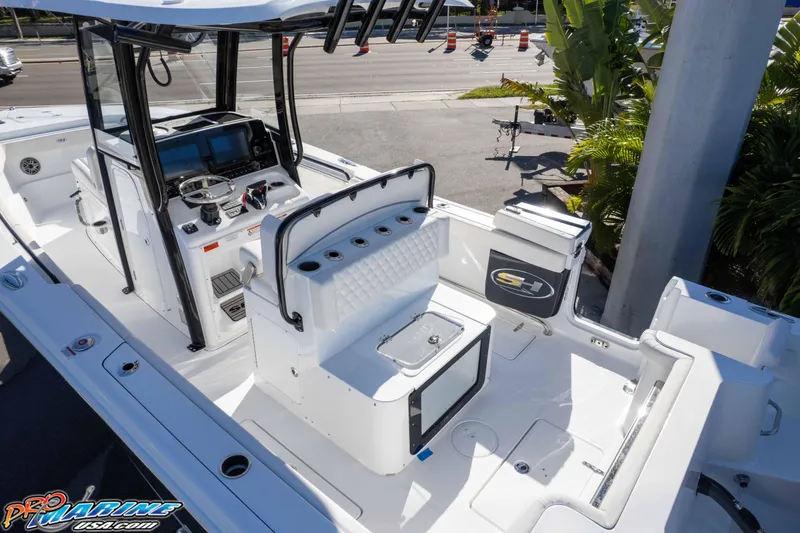 Slide: The Image of 2026 Sea Hunt Gamefish 27 Coffin Box boat interior with advanced controls and seating. - 44