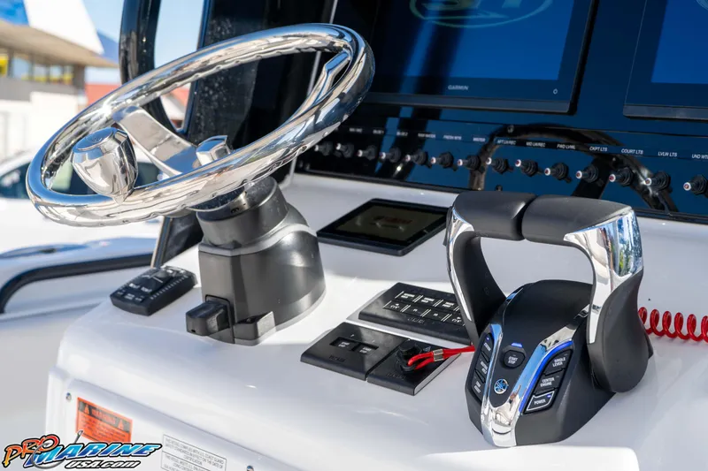 Slide: The Image of Steering console of 2026 Sea Hunt Gamefish 27 Coffin Box with modern controls and displays. - 48