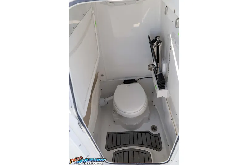 Slide: The Image of 2026 Sea Hunt Gamefish 27 Coffin Box boat interior with compact marine toilet. - 51
