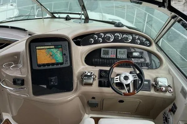 Slide: The Image of Control panel of a 2003 Sea Ray 410 Sundancer yacht with navigation equipment. - 11