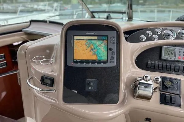 Slide: The Image of 2003 Sea Ray 410 Sundancer helm with navigation display and control panel. - 12
