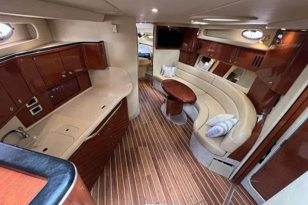 Slide: The Image of Luxurious interior of a 2003 Sea Ray 410 Sundancer yacht with elegant wood finishes. - 15
