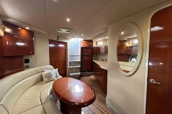 Slide: The Image of Luxurious interior of 2003 Sea Ray 410 Sundancer yacht with elegant wood finishes. - 19