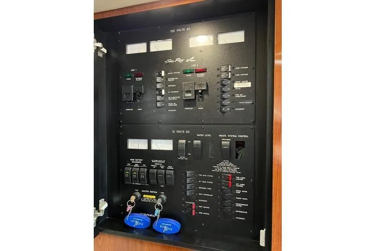 Slide: The Image of Electrical control panel of a 2003 Sea Ray 410 Sundancer boat. - 39