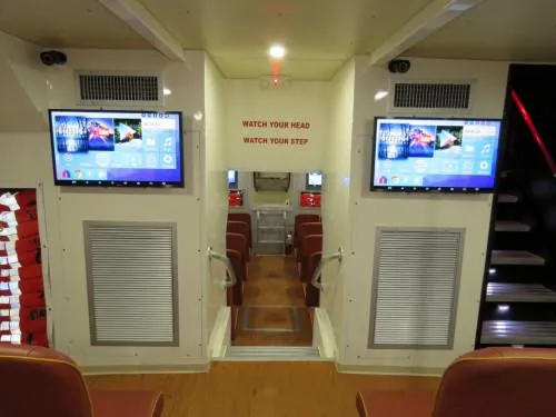 Slide: The Image of Interior of 1981 Midship Marine high-speed passenger ferry with modern screens and seating. - 18