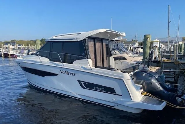 The Image of 2019 Jeanneau NC 895 boat docked at marina, side view. - 0