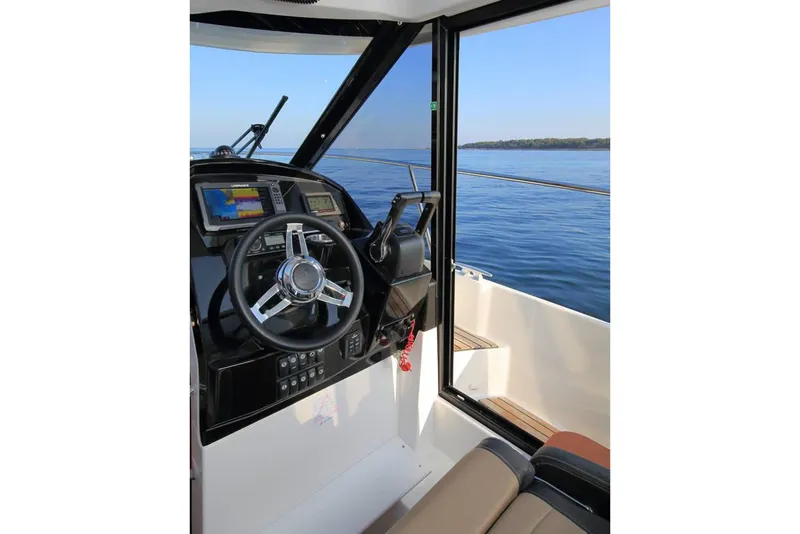 Slide: The Image of Manufacturer Provided Image: 2019 Jeanneau NC 895 boat cockpit with steering wheel and navigation system. - 4