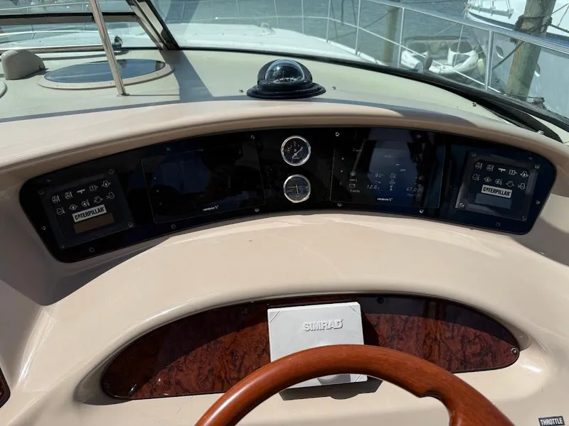 Slide: The Image of Dashboard of a 2000 Sea Ray 510 Sundancer yacht with navigation instruments. - 11