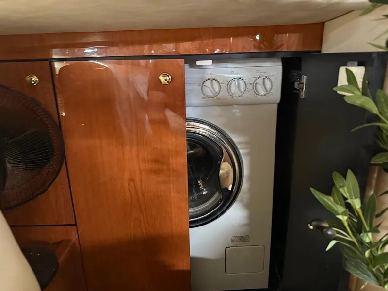 Slide: The Image of Washer in wooden cabinet on 2000 Sea Ray 510 Sundancer yacht interior. - 38