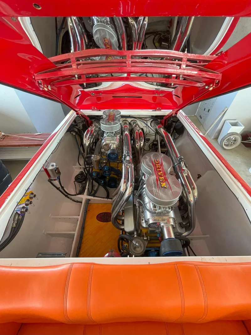 Slide: The Image of 2002 Cigarette ROUGH RIDER engine compartment with chrome details and vibrant red-orange accents. - 6