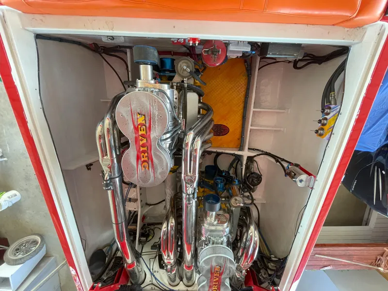 Slide: The Image of Engine compartment of a 2002 Cigarette ROUGH RIDER boat with chrome components. - 9