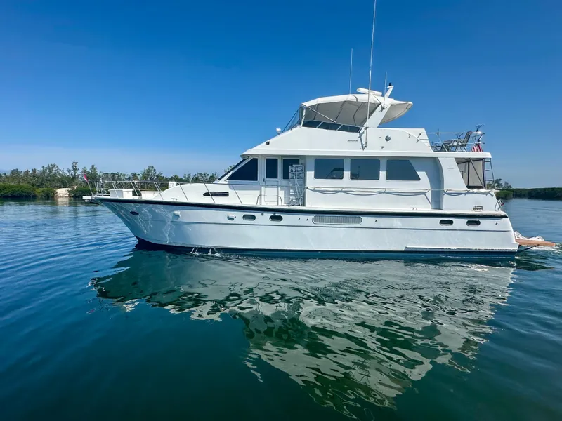 The Image of 2002 Jefferson Marquessa 57 MY yacht on calm water under clear blue sky. - 0