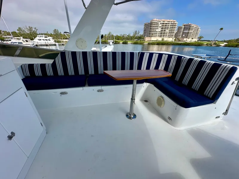 Slide: The Image of Outdoor seating area on a 2002 Jefferson Marquessa 57 MY yacht with striped cushions. - 13