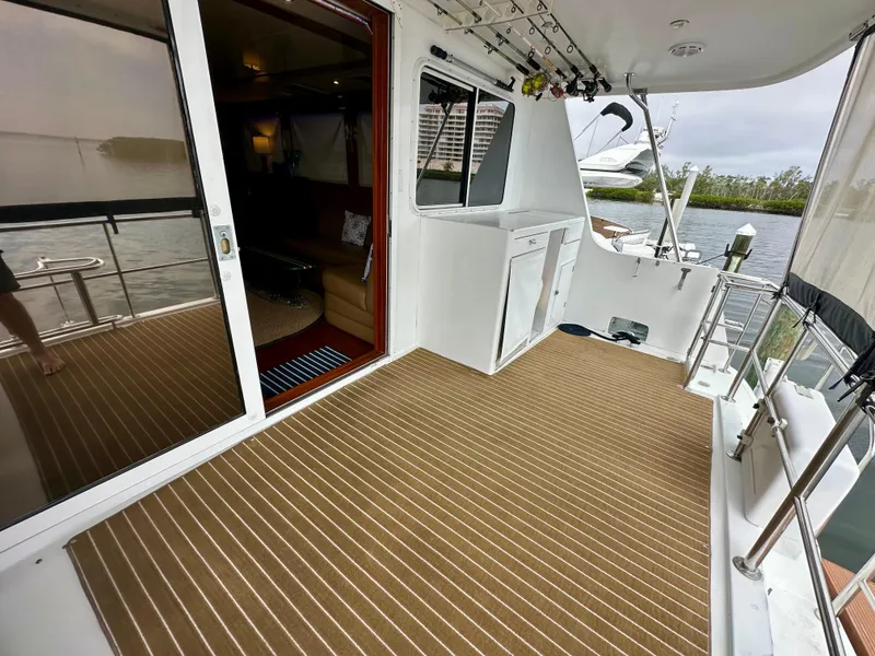 Slide: The Image of Jefferson Marquessa 57 MY 2002 yacht deck with striped flooring and interior view. - 17